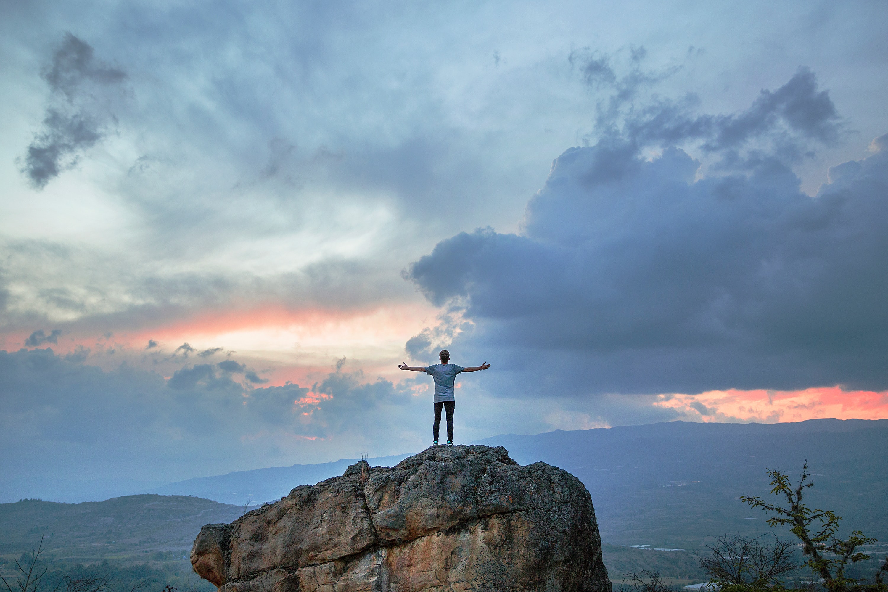 Man on a rock worshipping